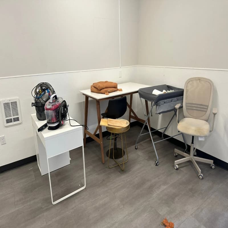 A room filled with office furniture in Seattle before junk removal